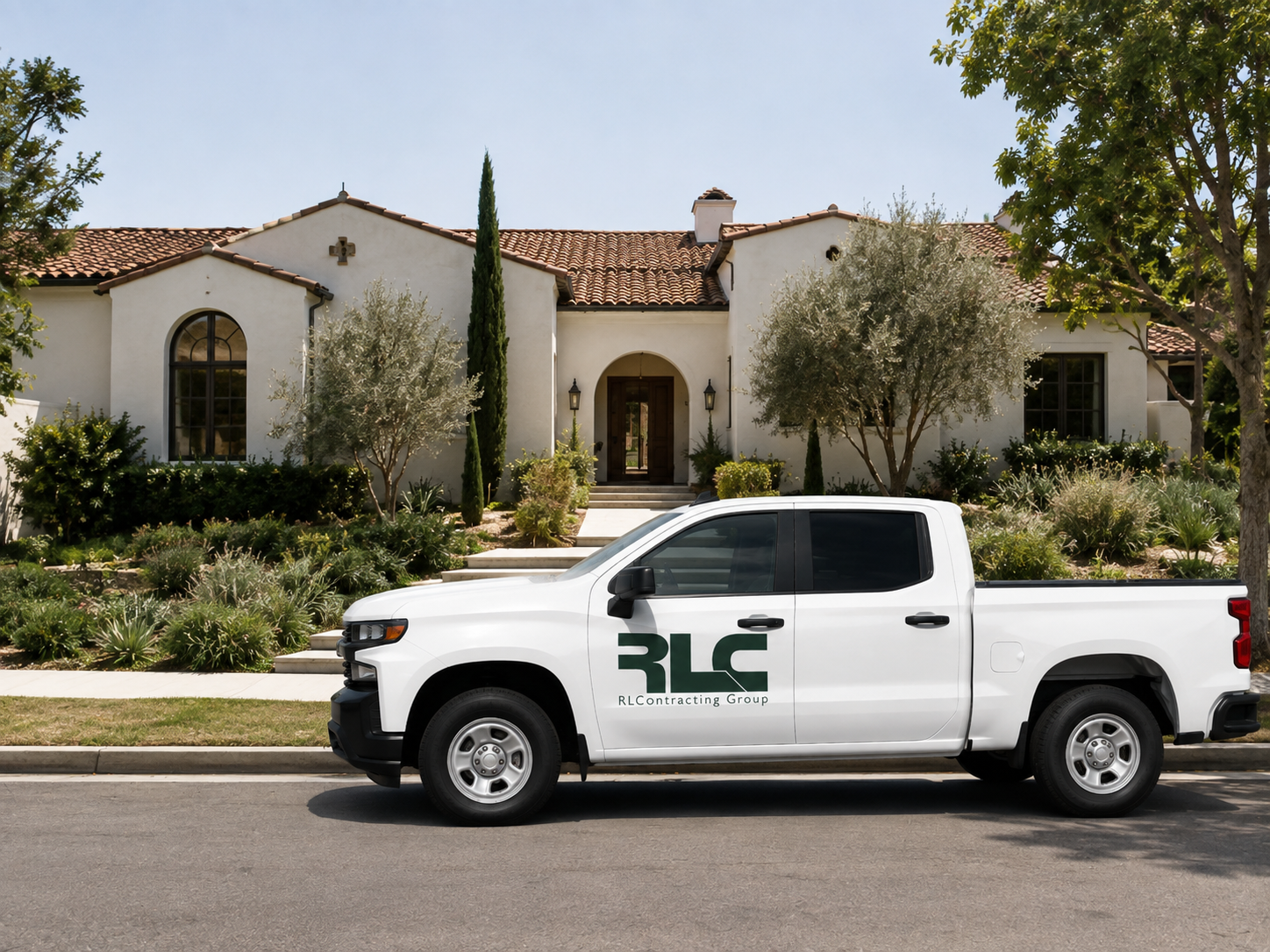 White pickup truck with RLC Contracting Group logo parked on the street in front of a white house with a red-tiled roof, surrounded by trees and landscaping.