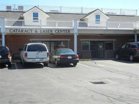 Parking lot in front of Cataract & Laser Center with parked cars