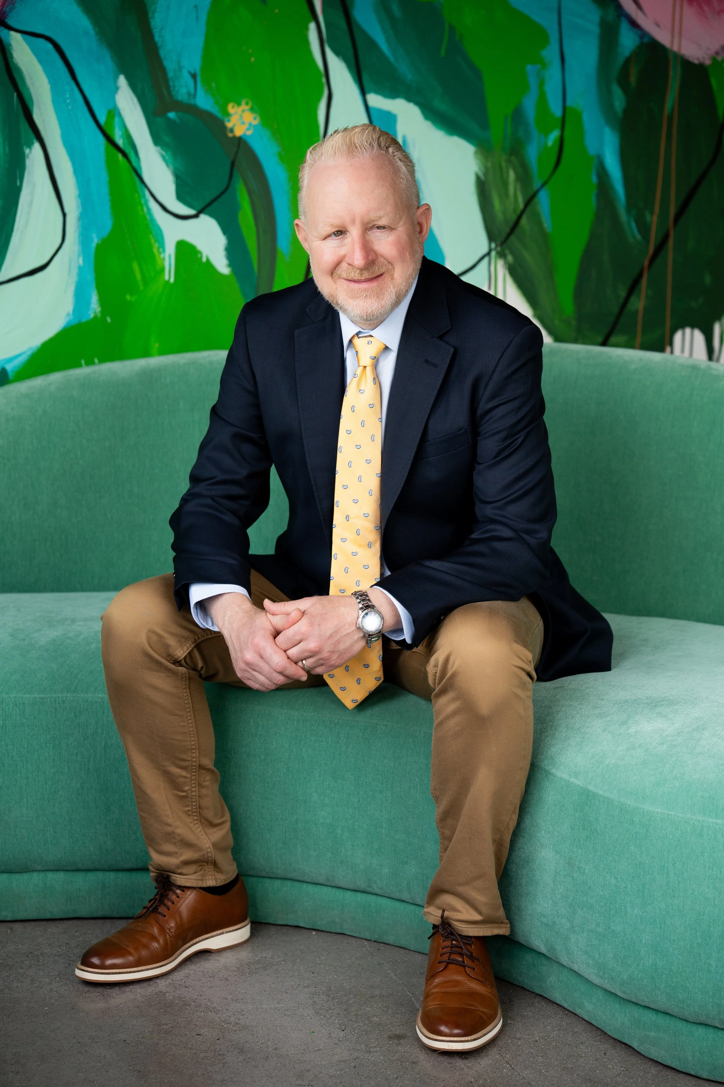 Headshot of Brian inviting the viewer to sit and talk through their career goals
