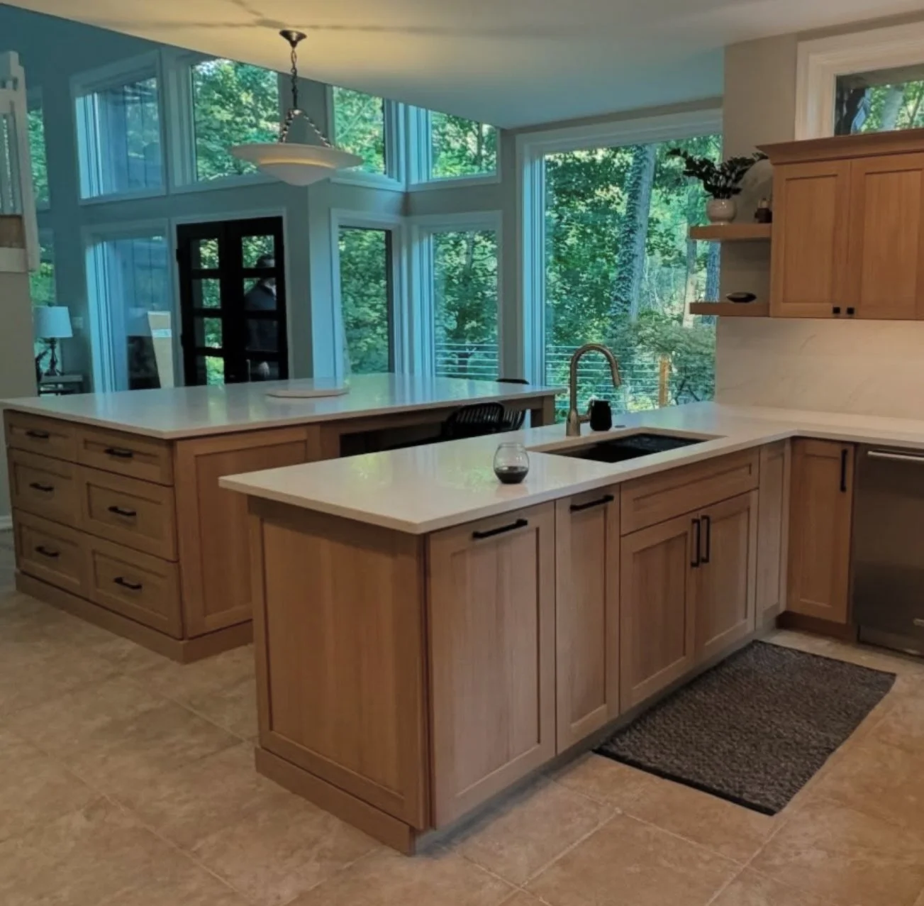 Custom kitchen with white oak cabinets and peninsula workspace in Troy, Michigan