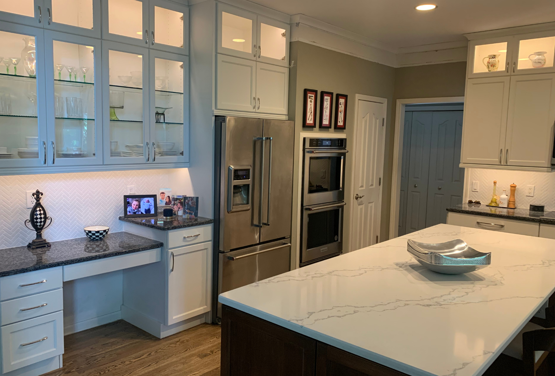 Custom white kitchen cabinets with built-in desk in Macomb County, Michigan