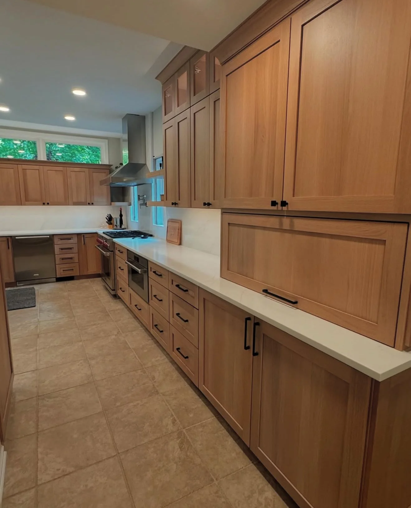 Modern custom kitchen with white oak pantry cabinets in Shelby Township, Michigan