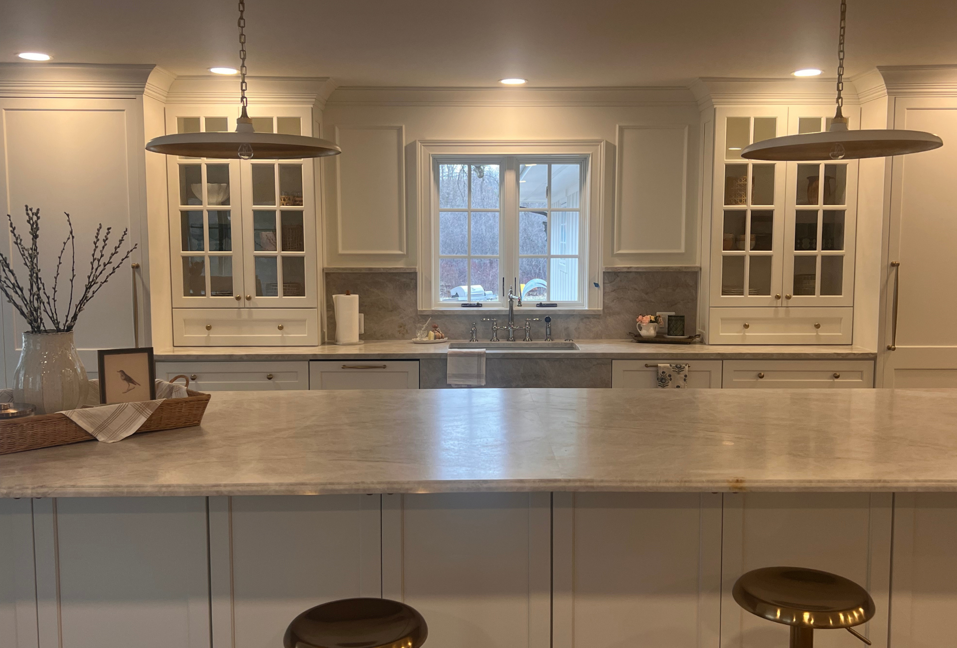 Custom white kitchen cabinets with oversized island in Lapeer County 