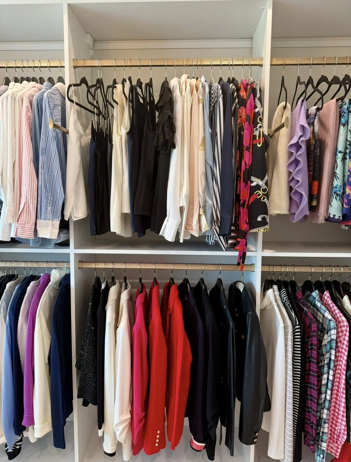 an organized closet featuring women's clothing