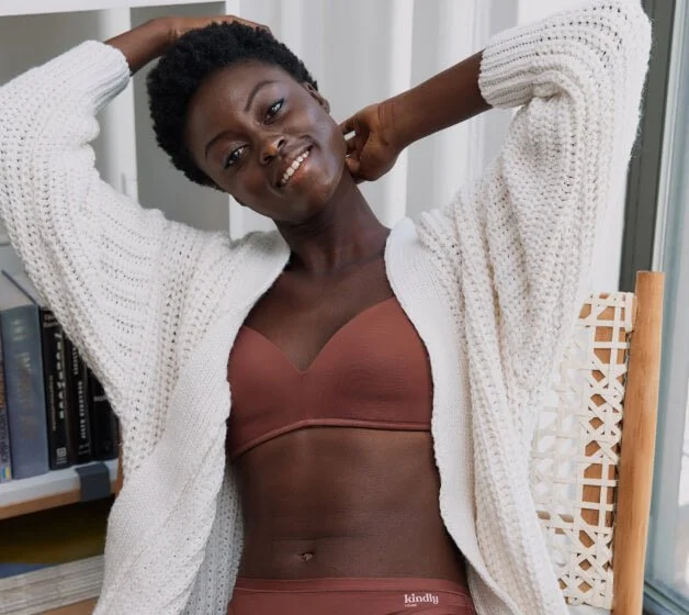 Model wearing a Kindly brown bra and panties.