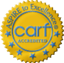 CARF Accredited badge with blue text on a yellow circular background