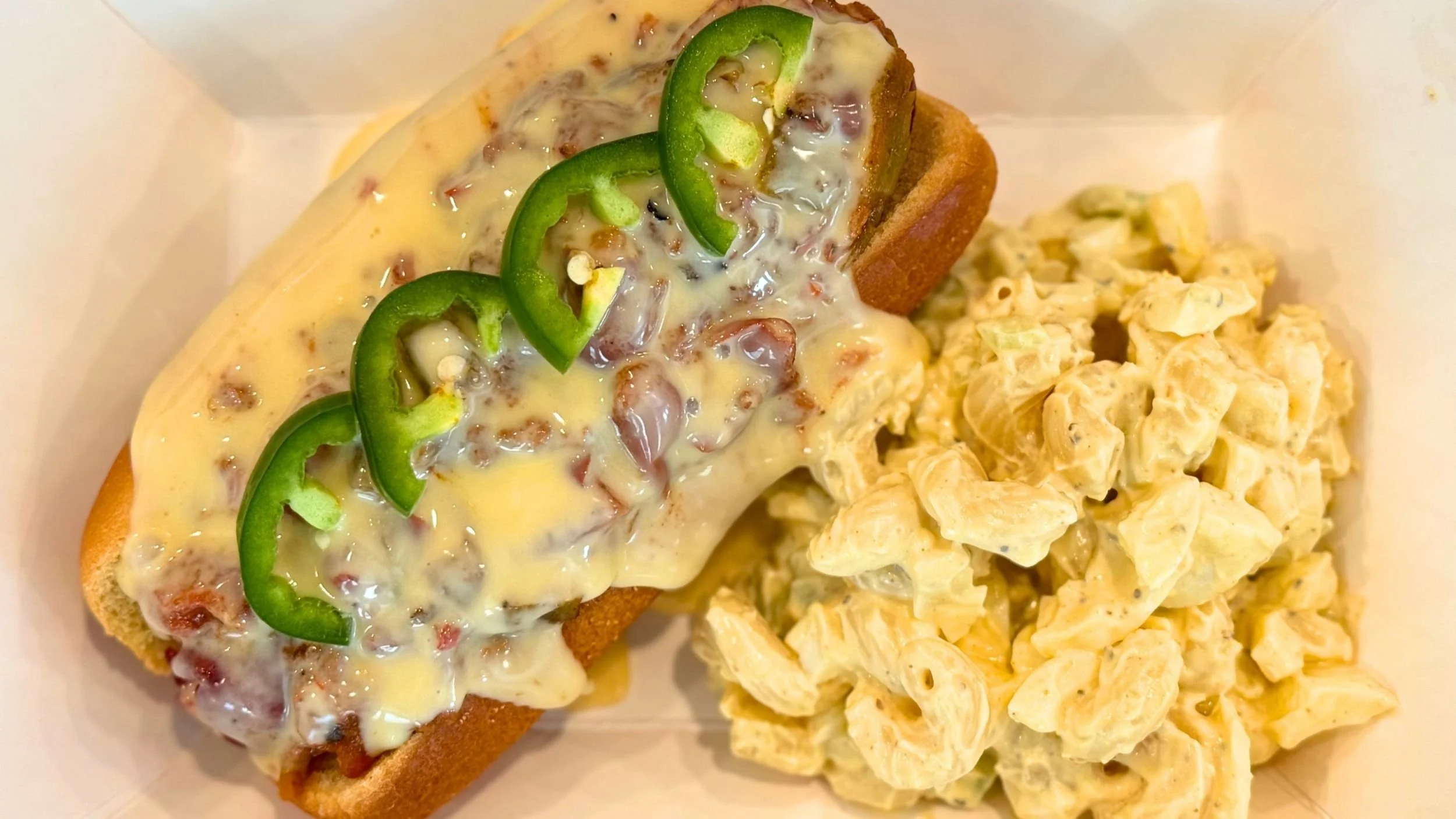 wagyu hot dog with cheese, jalepeno, and macaroni salad