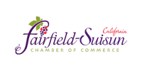 A colorful logo for Fairfield Susan G. Komen, featuring purple, pink, and yellow text and a pink ribbon symbol.
