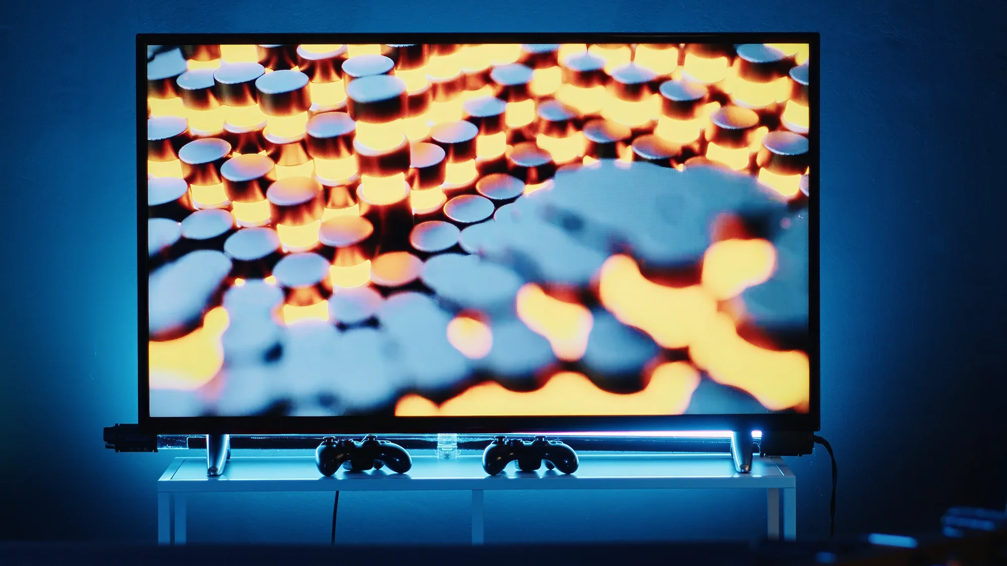 OLED TV displaying deep blacks and vivid colors in a dark home theater.