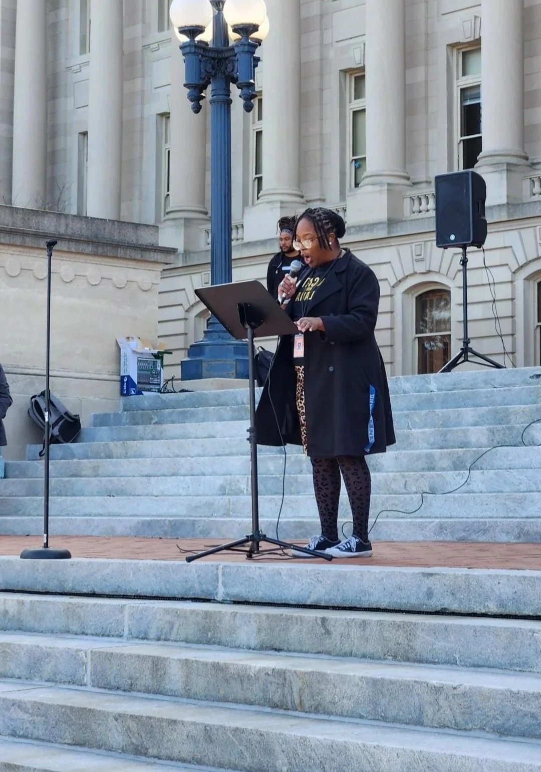 Megan Speaking on the Steps of Frankfort