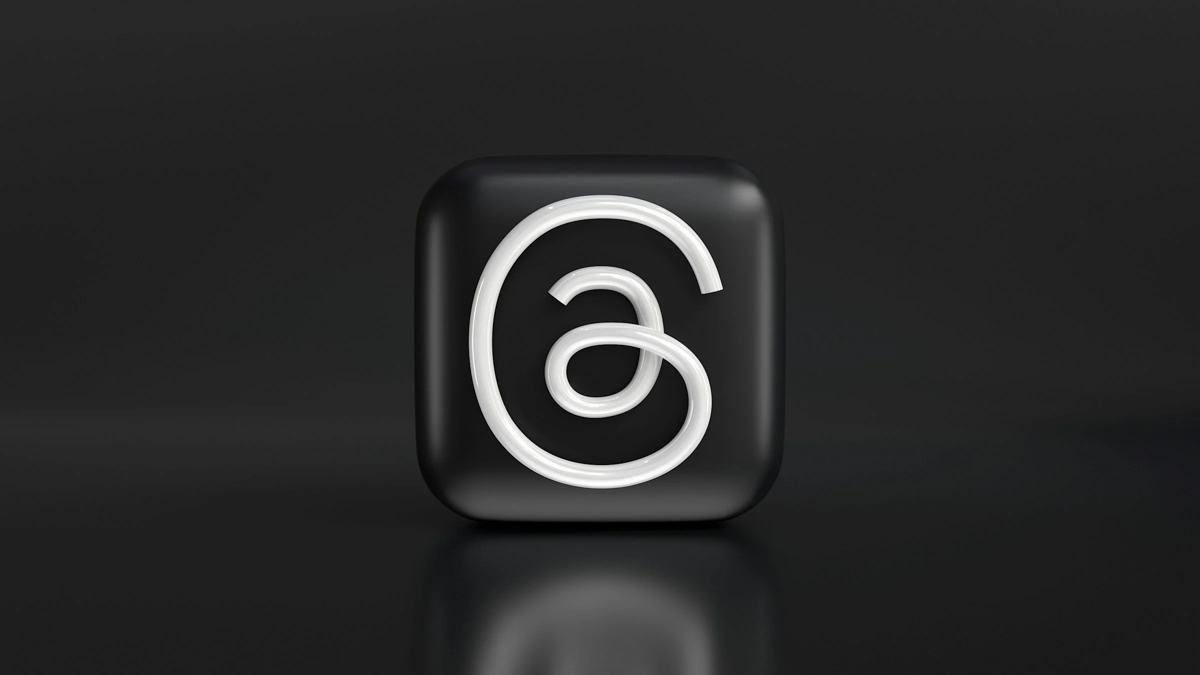 Neon sign with a white lock icon on a black background.