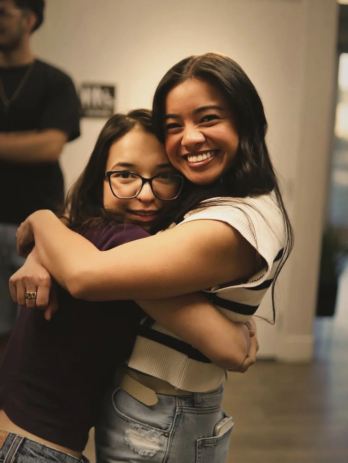 TEENAGE GIRLS HUGGING