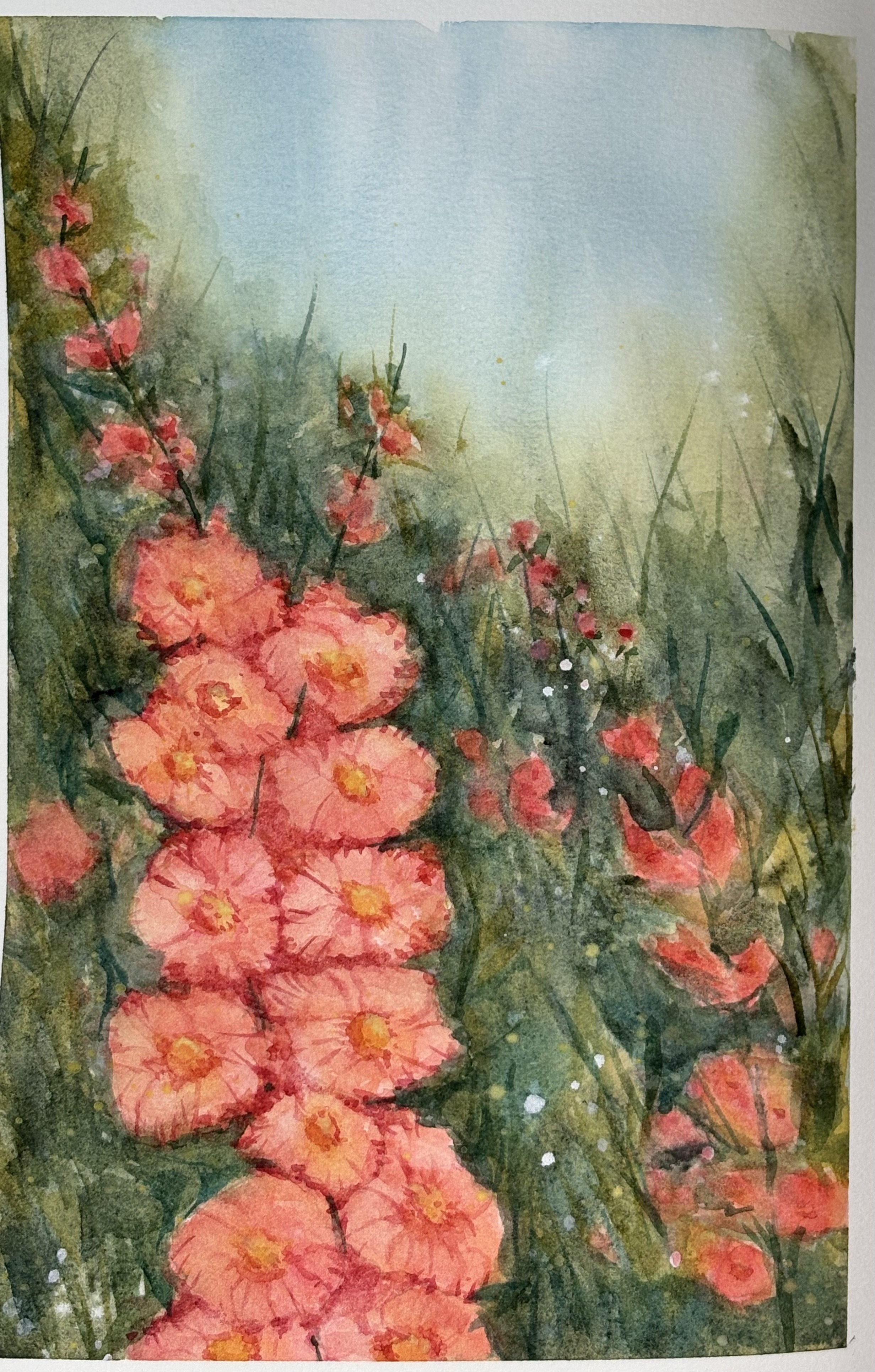 Watercolor painting of pink and orange flowers with green foliage and subtle blue sky background. Journal painting of foxglove flowers in a meadow. Painting done in Etchr journal.