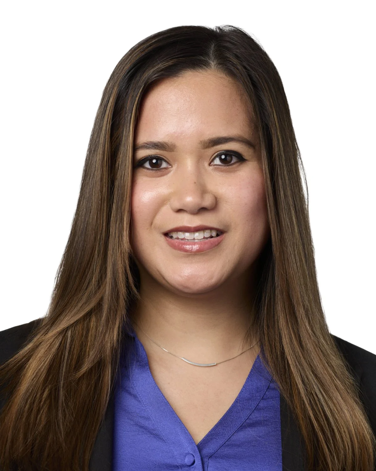 Headshot of a woman with long brown hair, wearing a blue top and black blazer, smiling.