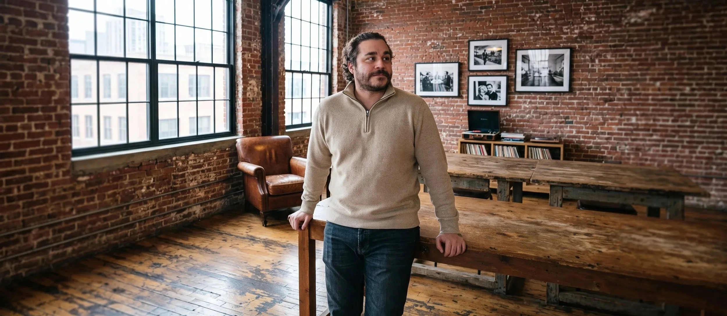 Austin Lara, social media manager and photographer, standing in a creative studio space