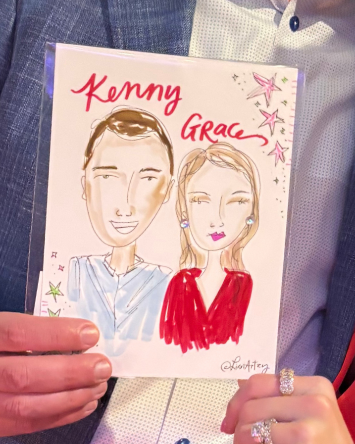 Caricature drawing of a man and woman with handwritten names 'Kenny' and 'Grace' at the top, surrounded by stars and decorative elements. The man is smiling, wearing a light-colored shirt, and has short hair. The woman has long hair, lips painted pin