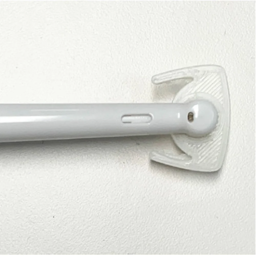 Close-up of a white mounted wall grab bar for support.