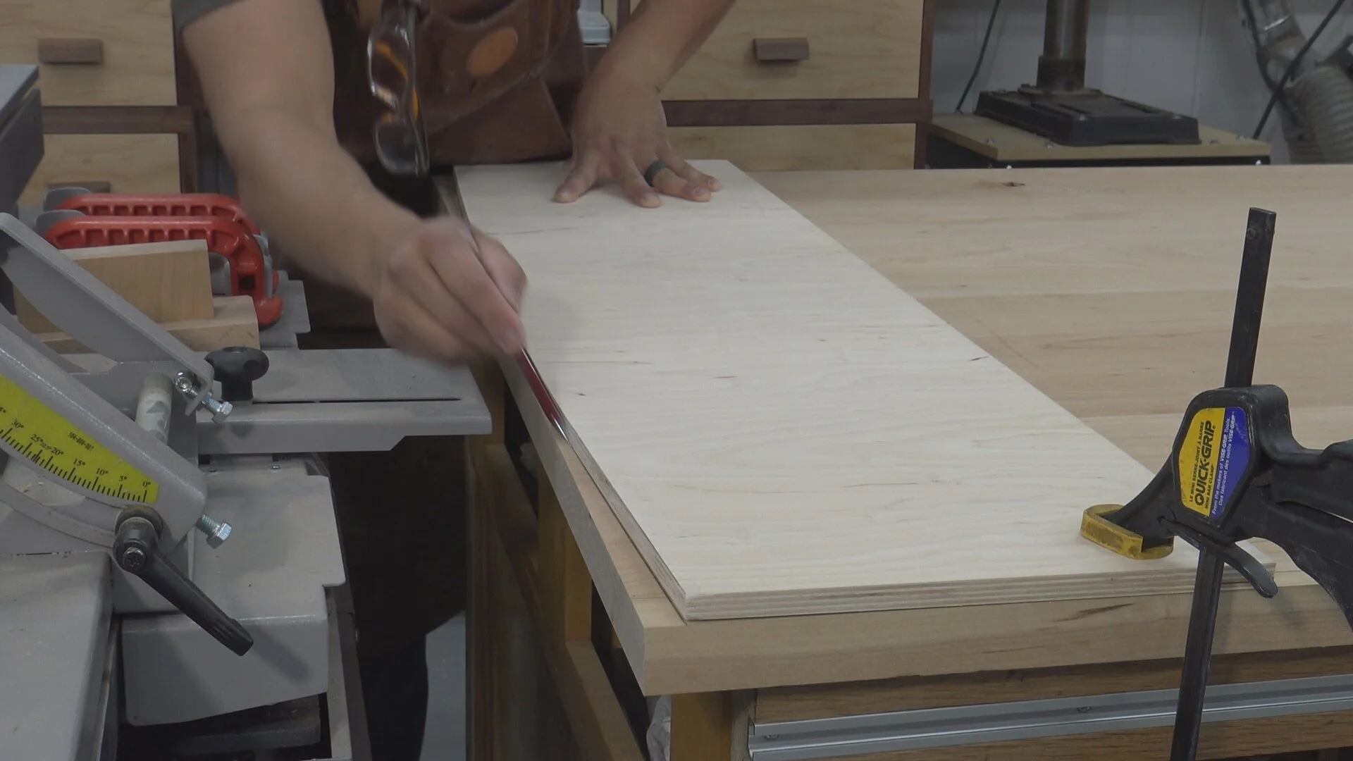 Tracing out the curve of my template onto the table top. Having square edges makes sure the template is perfectly aligned.