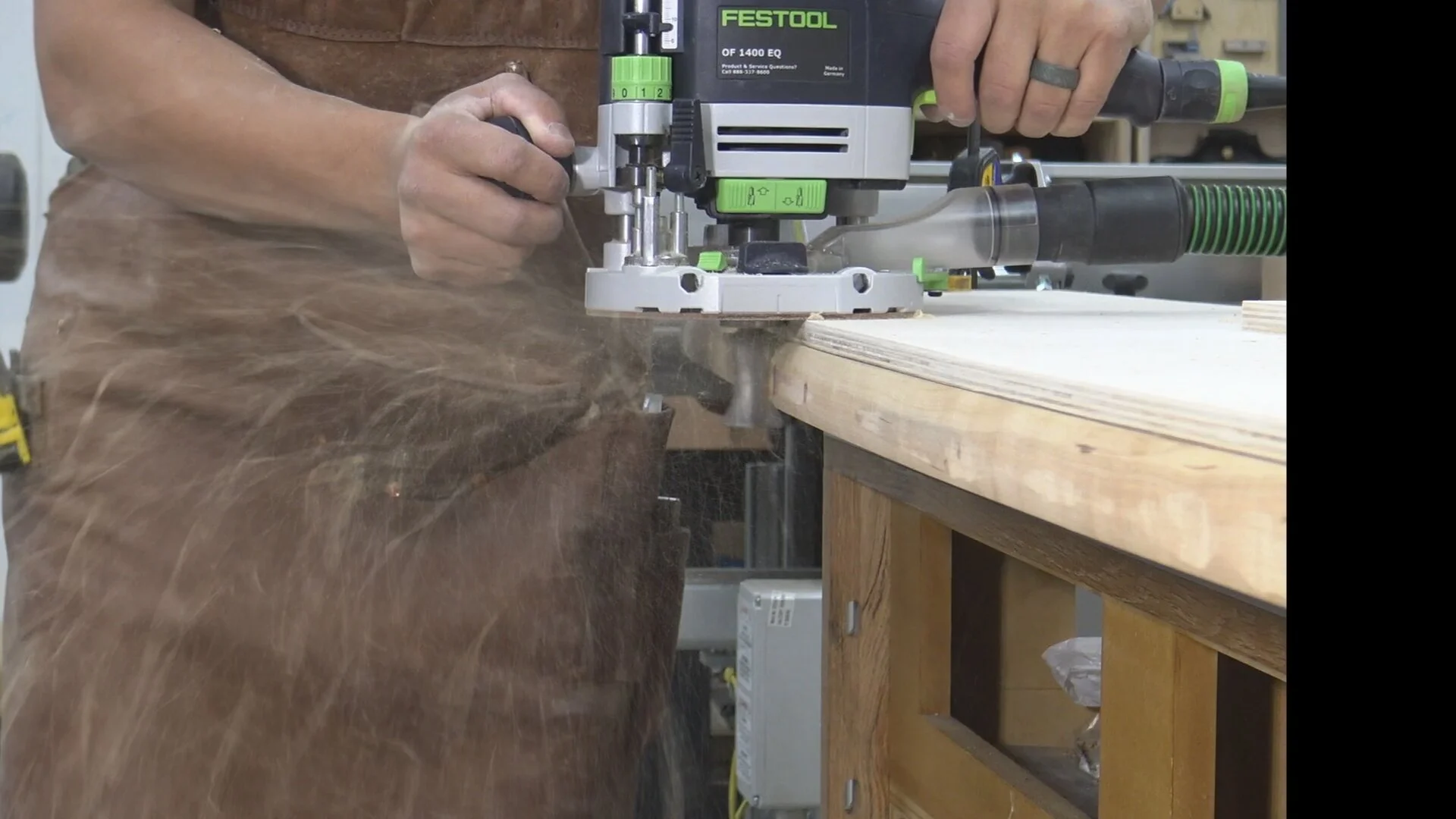 Using the template as a guide for the router bit
