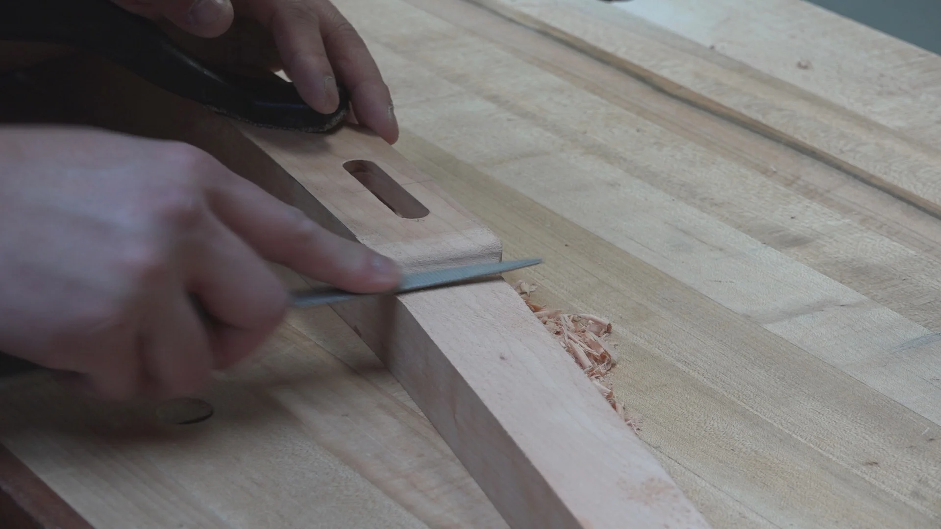 The rasp continued to smooth out the transition from the cloud lift to flat cut made by the table saw. Hand sanding finished this transition.