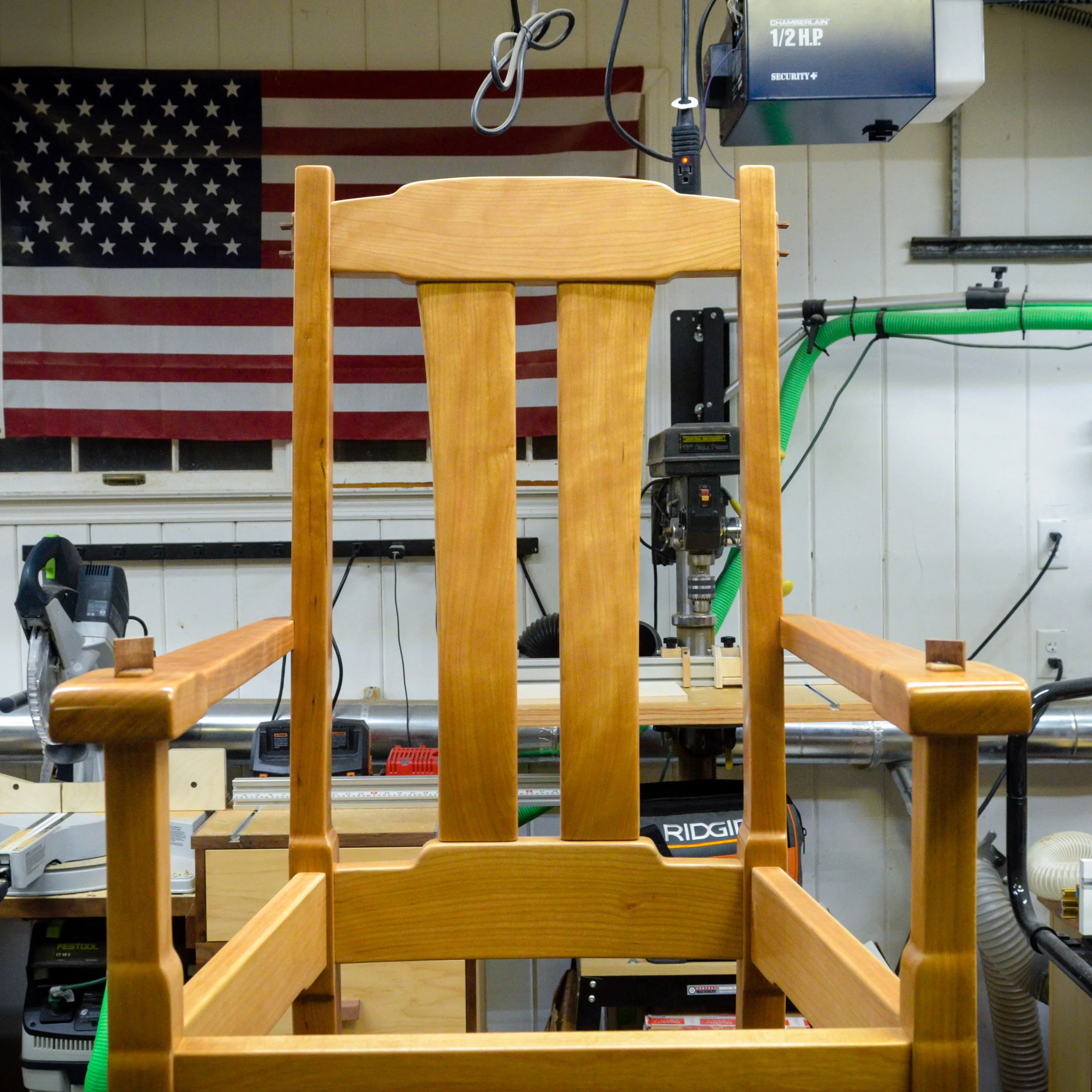 The interior cloud lift adds a beautiful detail to an Arts &amp; Crafts style chair.
