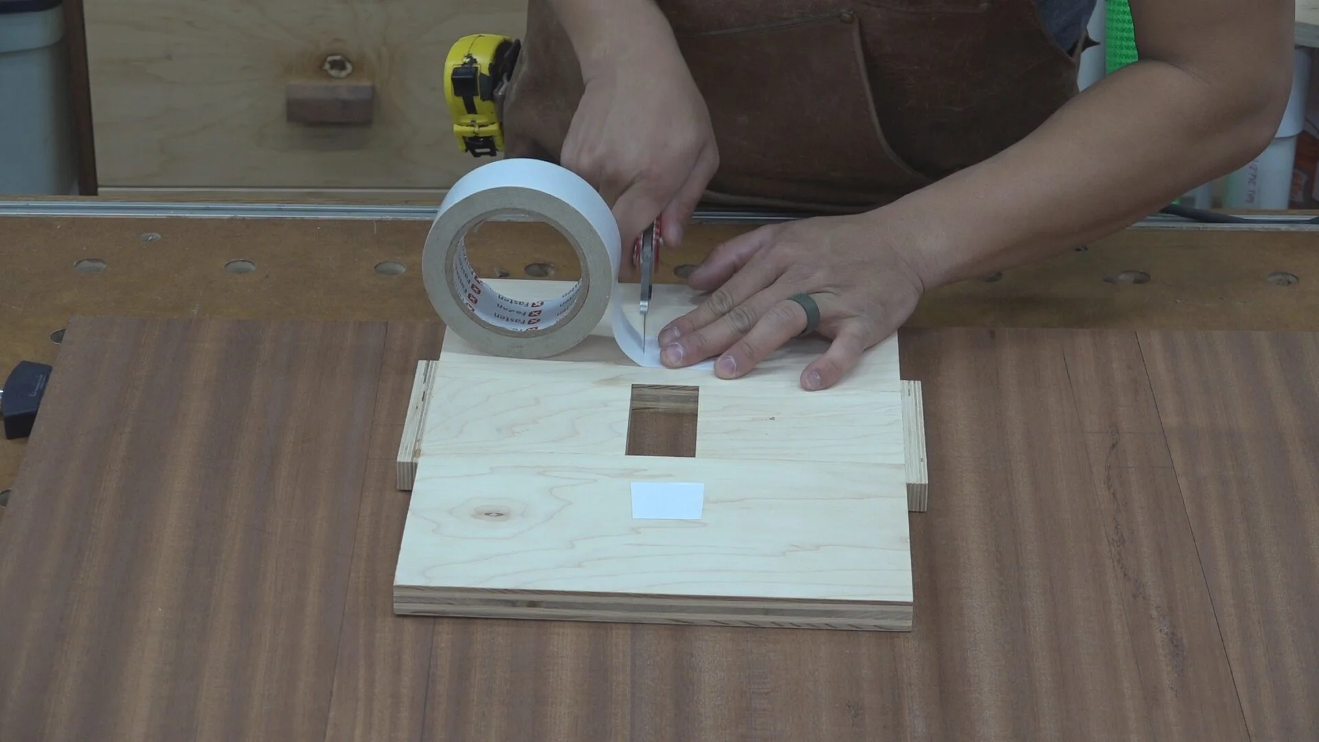 I use double stick take to attach the template to the table top. This offers plenty of temporary holding power.
