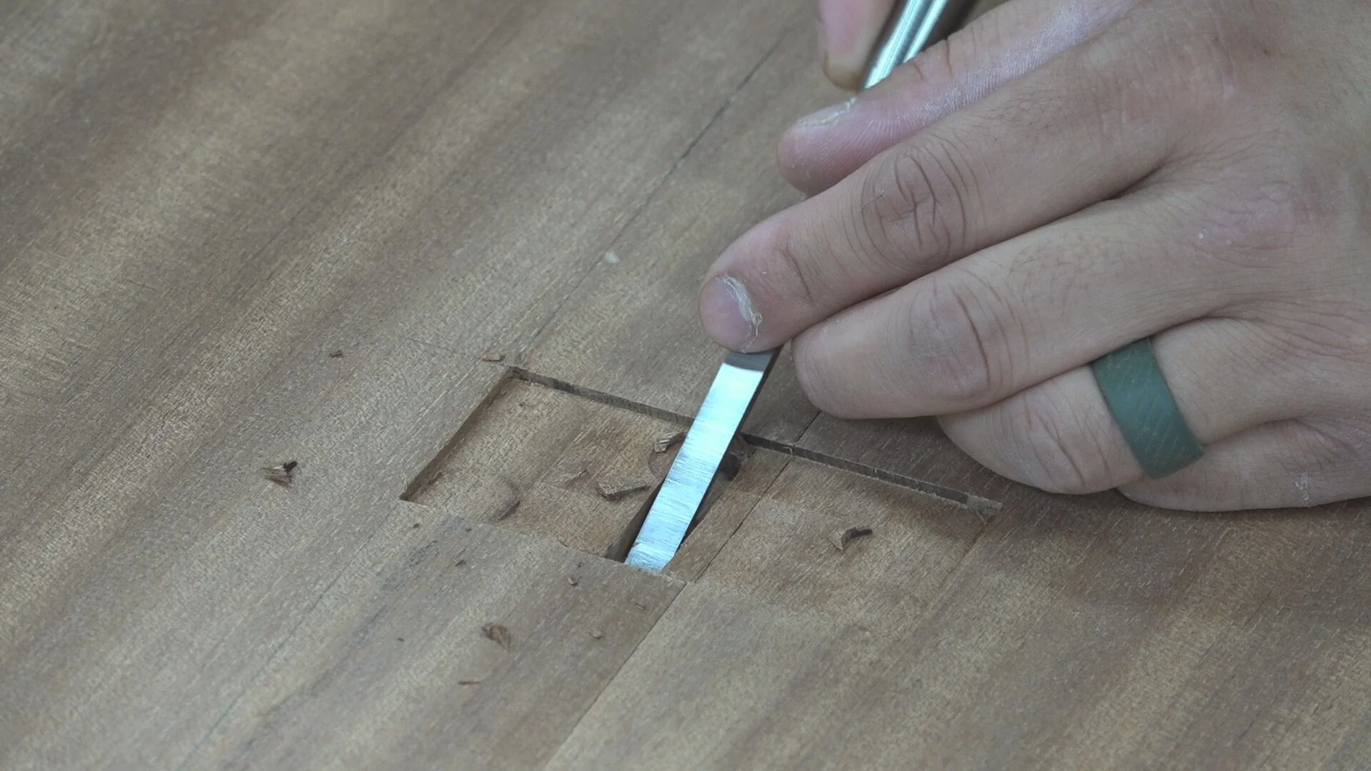 Once I remove the template, I then square up the hinge knuckle mortise with a chisel.