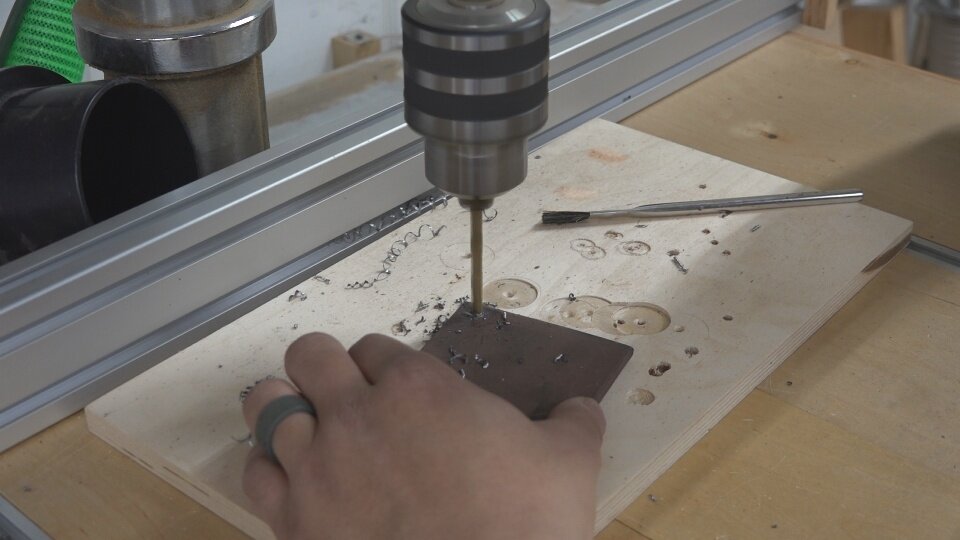 The legs of the steel table were capped with a piece of 3” square flat bar.