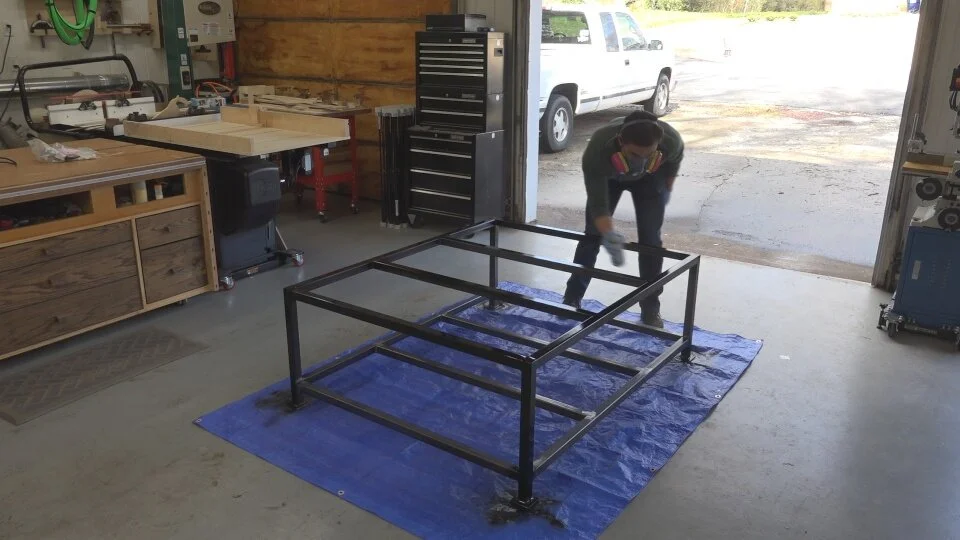 The steel table base received a coat of black spray paint to protect it from rust.