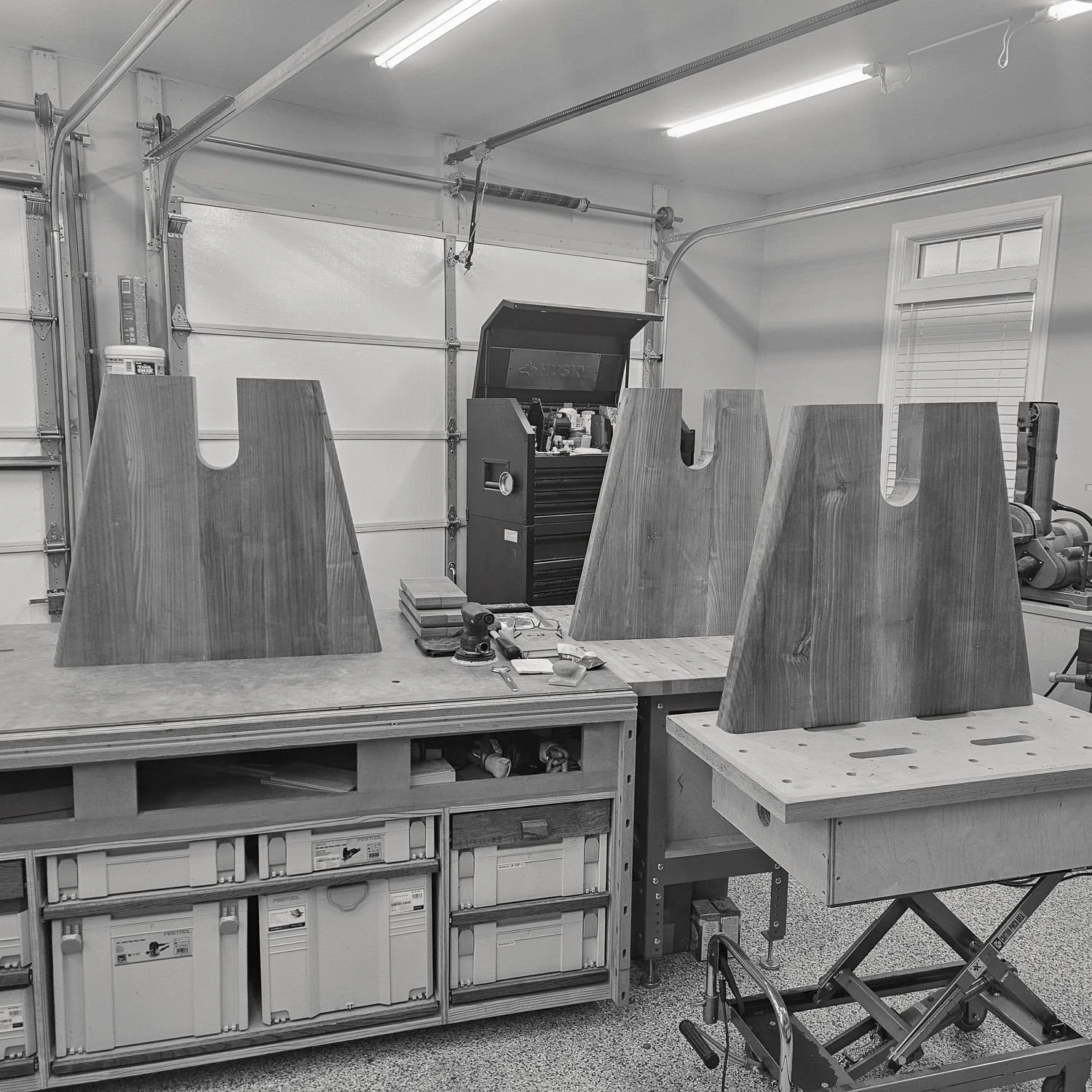 Trestle base pieces arranged on a workbench (Copy)