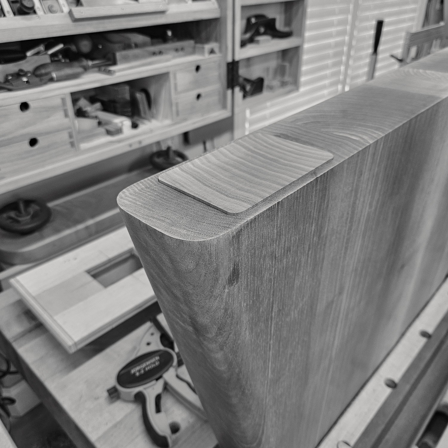 Close-up of a shaped wooden trestle component in the workshop (Copy)