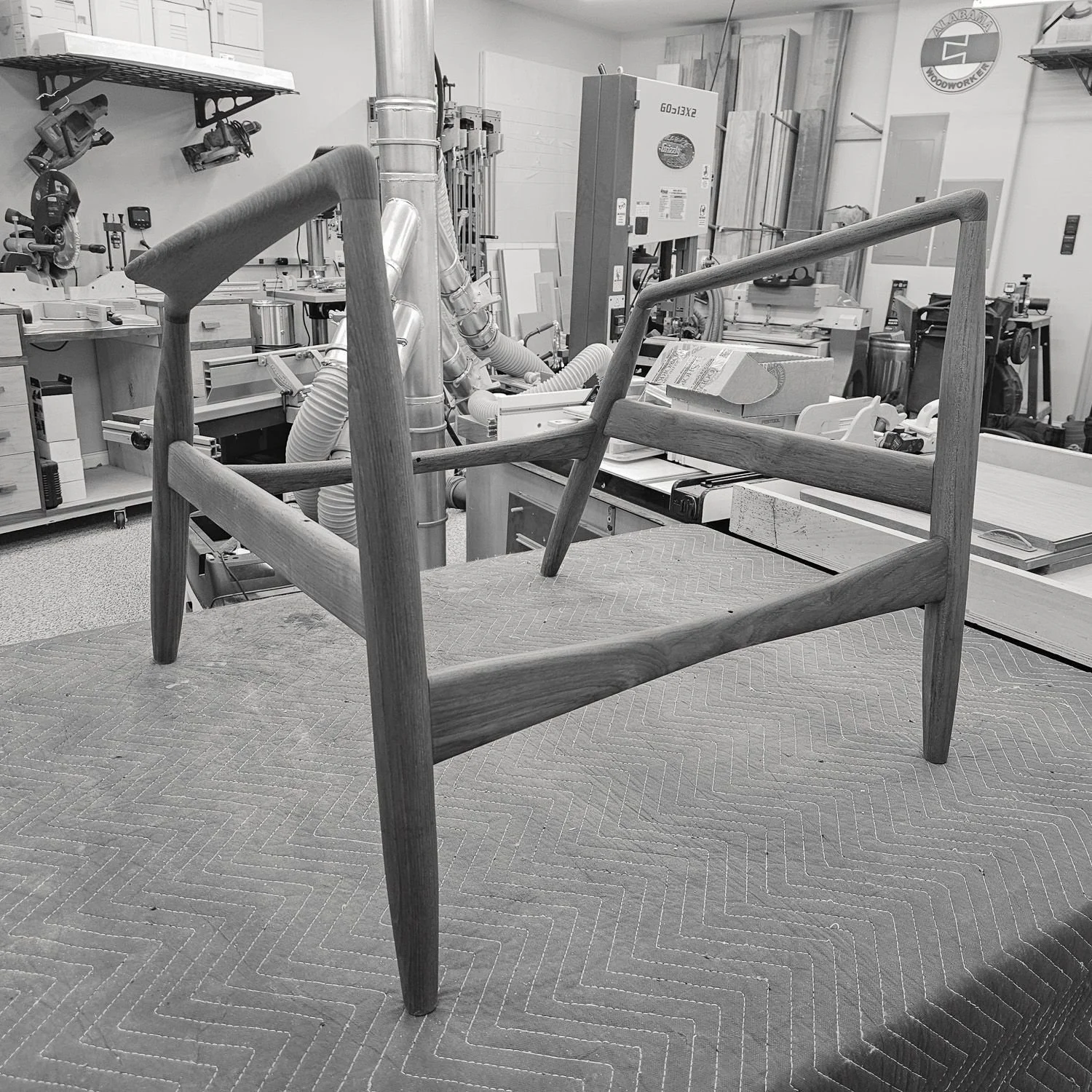 Bare teak frame of the Seal lounge chair in the workshop (Copy) (Copy) (Copy) (Copy)