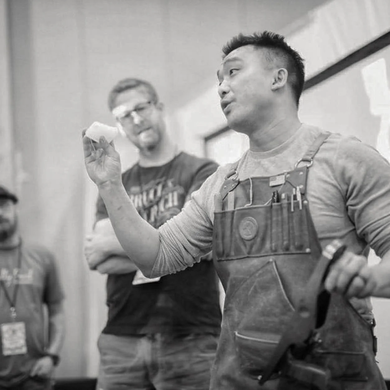 Woodworking instructor speaking during a hands-on workshop.