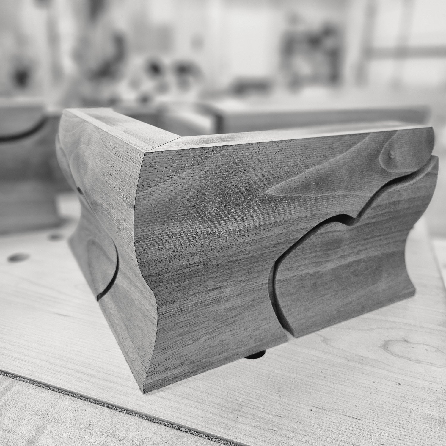 Sculpted walnut ogee bracket foot assembly during construction of the Masterworks china cabinet.