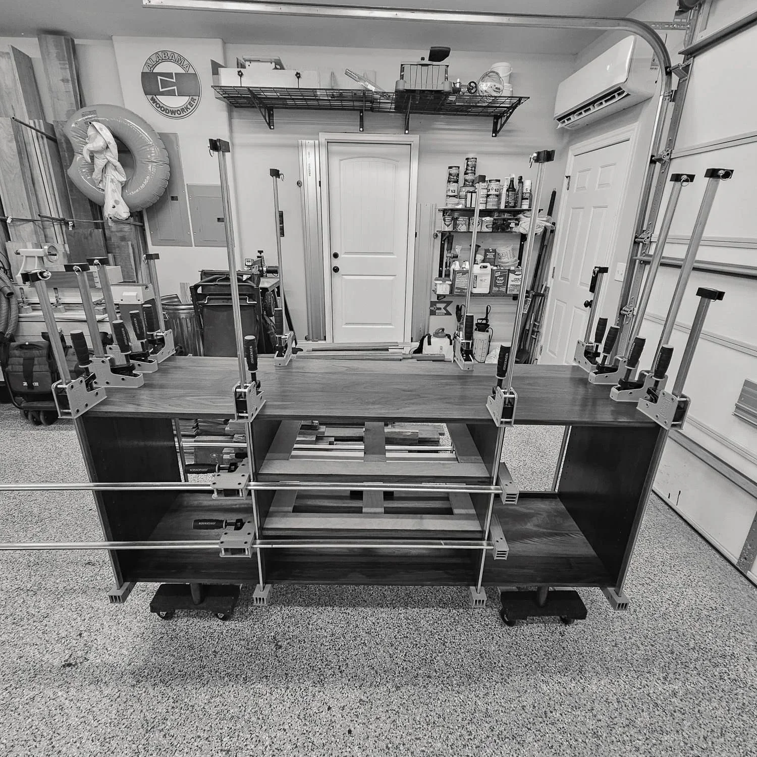 Modern Walnut Sideboard clamped during assembly in the workshop