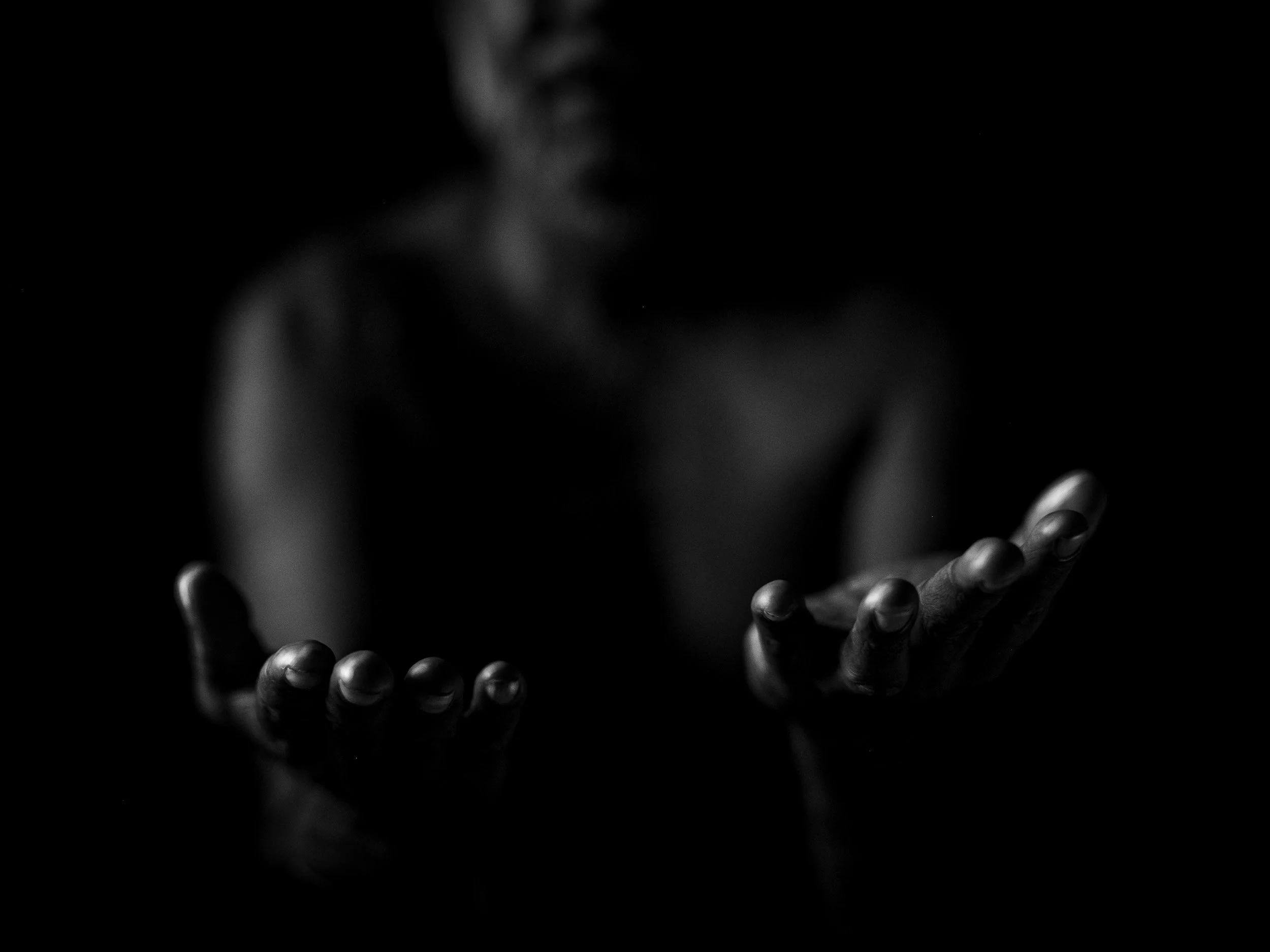Black and white fine art portrait from From Land to Sea by Tommy (Thomas) Salpietro, depicting a Kuku Yalanji man in Far North Queensland, Australia.