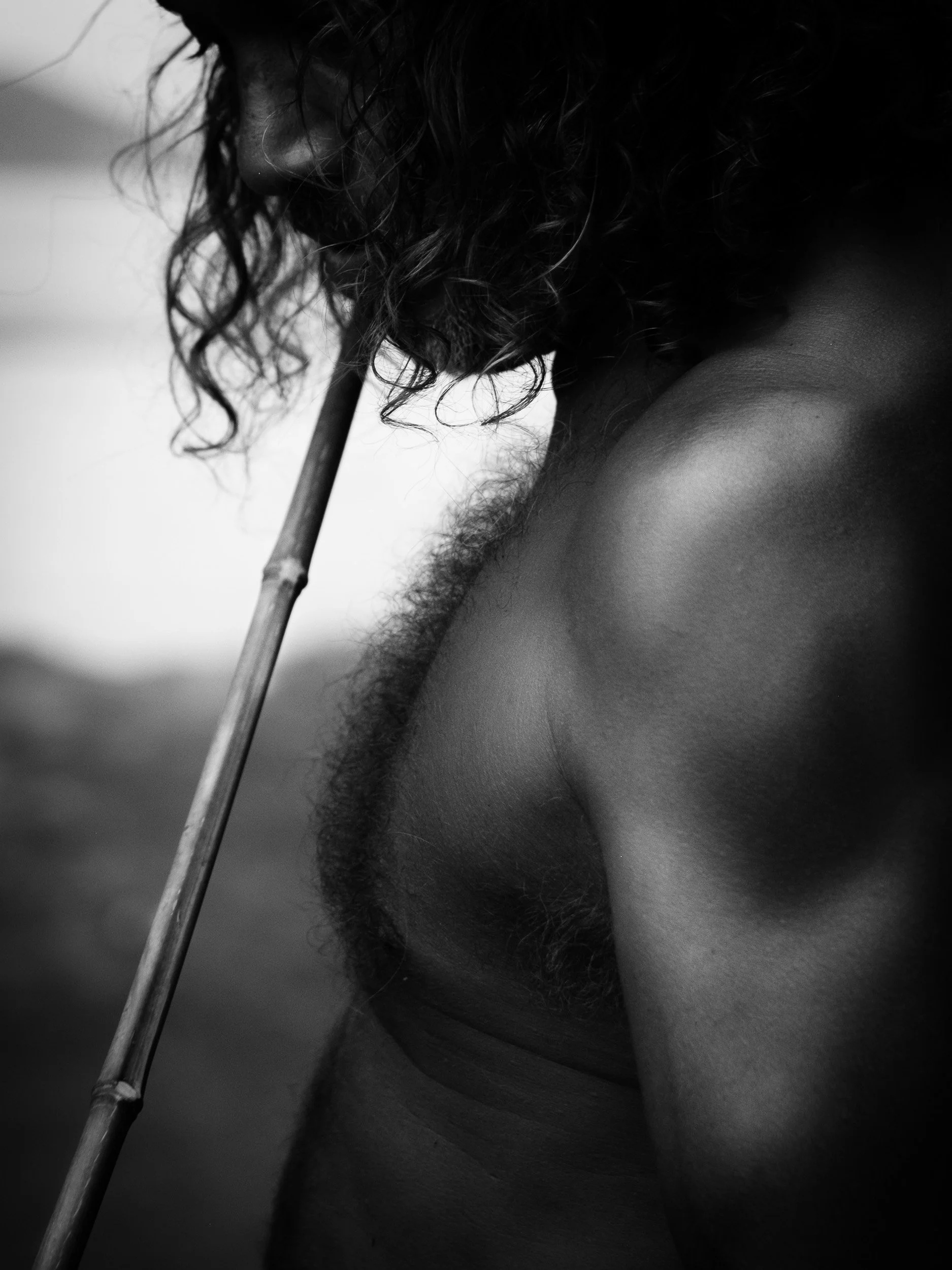 Black and white fine art portrait from From Land to Sea by Tommy (Thomas) Salpietro, depicting a Kuku Yalanji community member. Documentary photography exploring Indigenous Australian culture, identity and tradition.