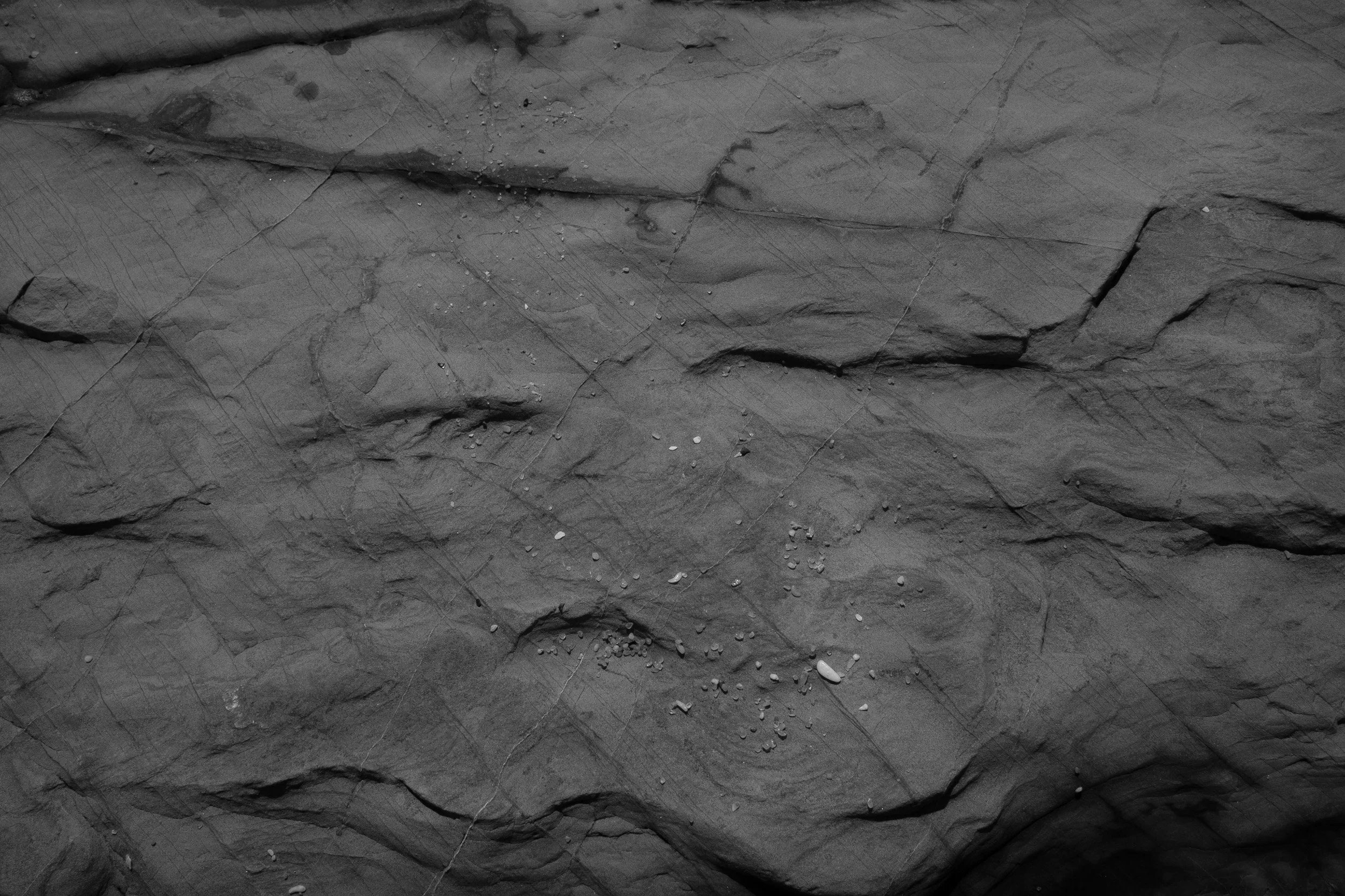 Black and white fine art photograph from STRATA by Tommy (Thomas) Salpietro, exploring weathered rock shaped by millions of years of erosion.