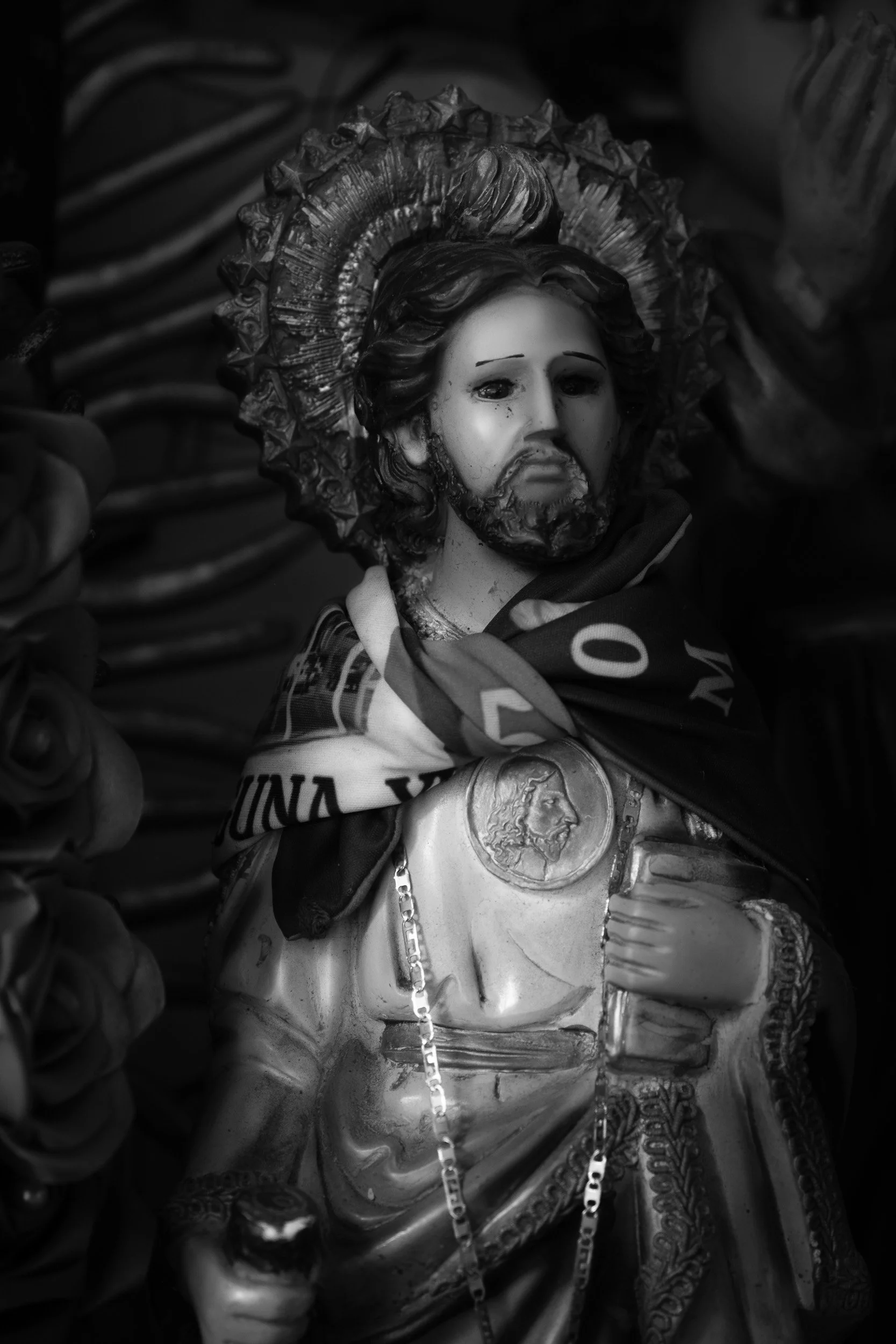 Black and white fine art photograph from From Land to Sea by Tommy (Thomas) Salpietro, depicting a Catholic religious statue in the Yucatán Peninsula, Mexico, exploring faith, tradition and identity.