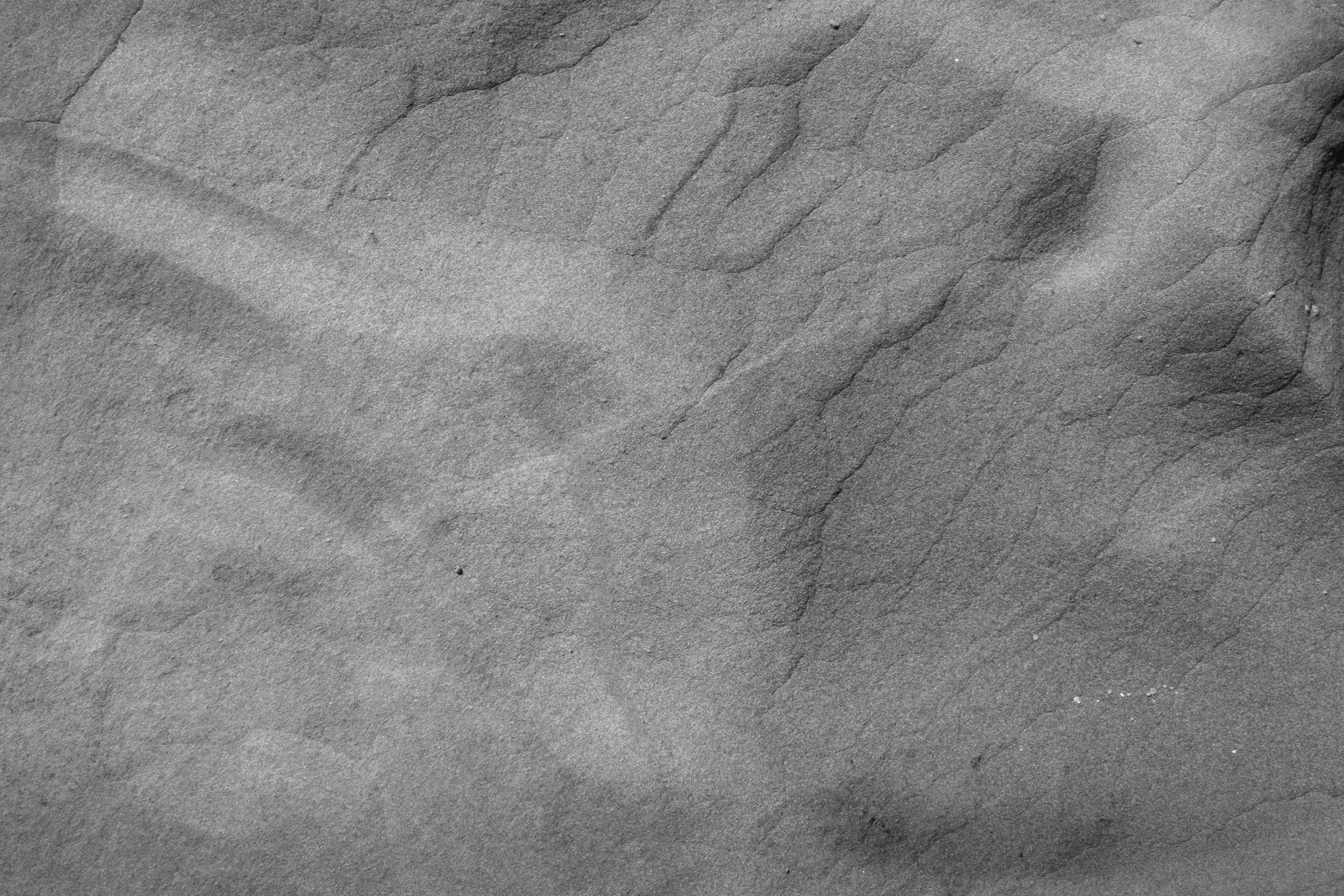 Black and white fine art photograph from STRATA by Tommy (Thomas) Salpietro, revealing layered stone textures along Victoria's southern coastline, Australia.