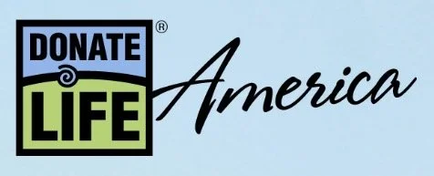 Donate Life America logo with a blue background, featuring the words "Donate" in black, "Life" in green, and "America" in black script.