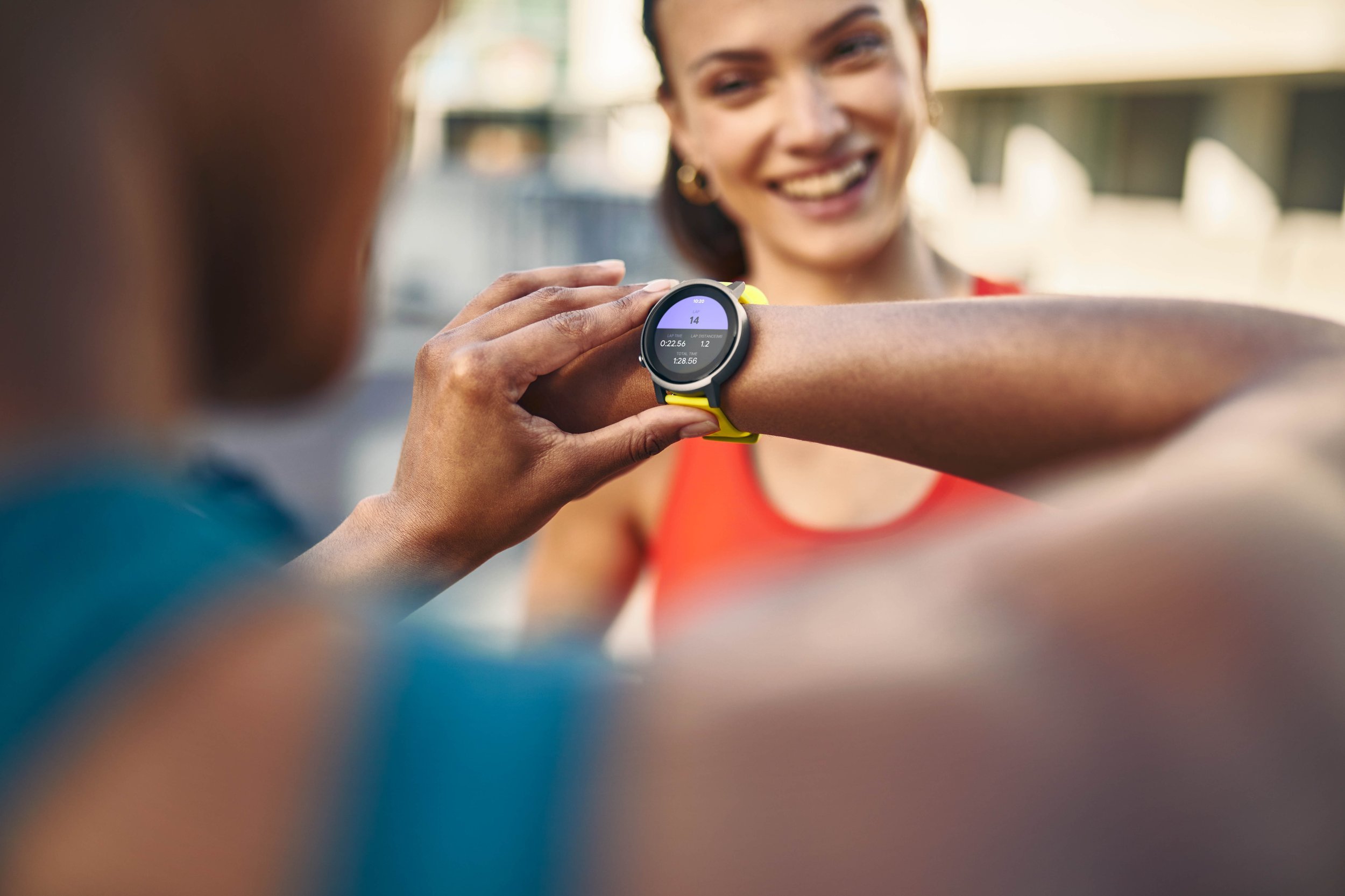 Two friends set off for a run in the city using smart watches to track their runs. Lifestyle photography by Jon Enoch.