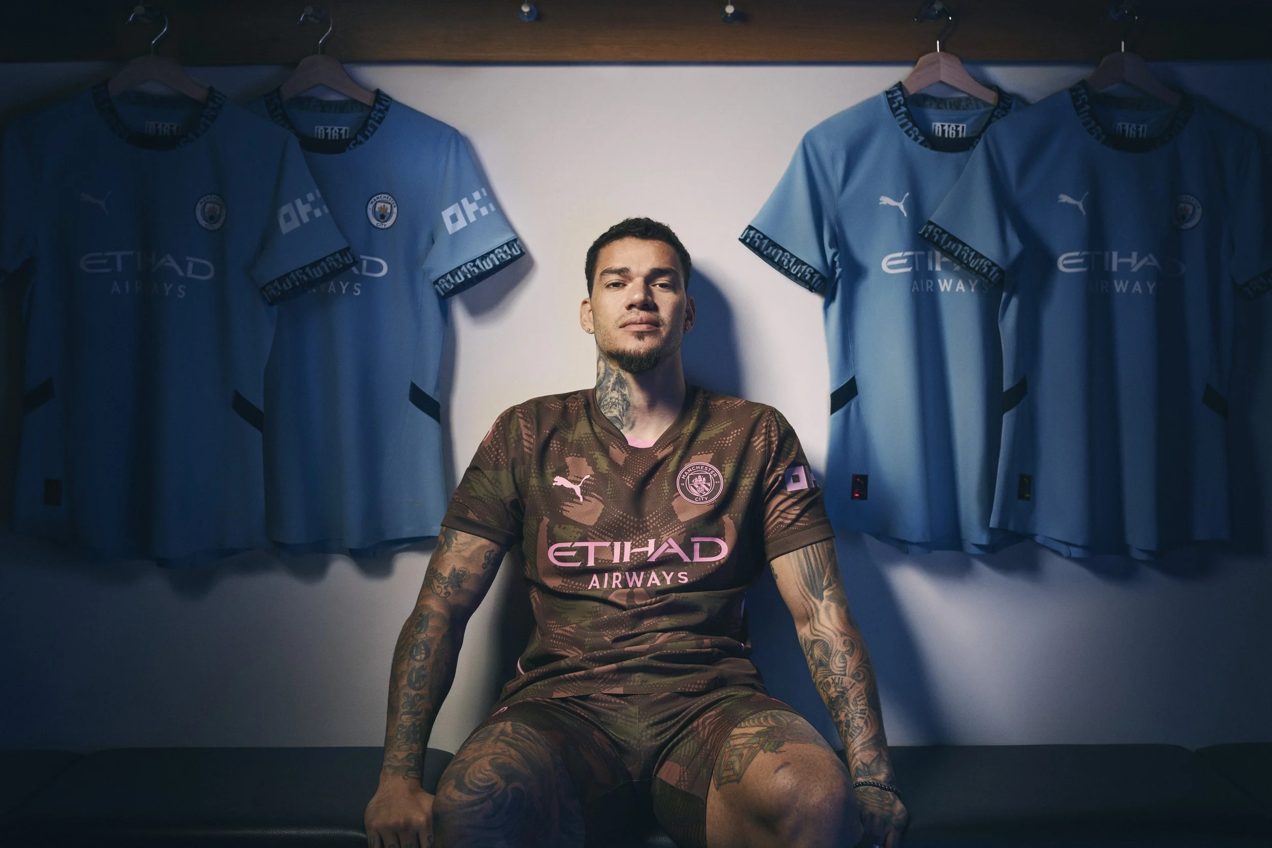 Manchester City goalkeeper Ederson photographed in the club dressing room for the OKX My Fabric campaign.