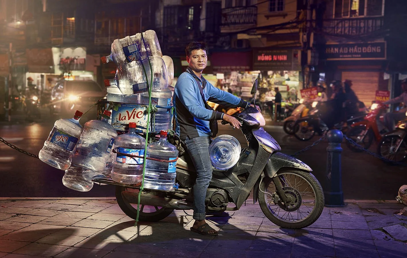 Advertising photographer Jon Enoch’s latest project ‘Bikes of Hanoi’ showing motorbikes carry goods around the city of Hanoi, Vietnam.