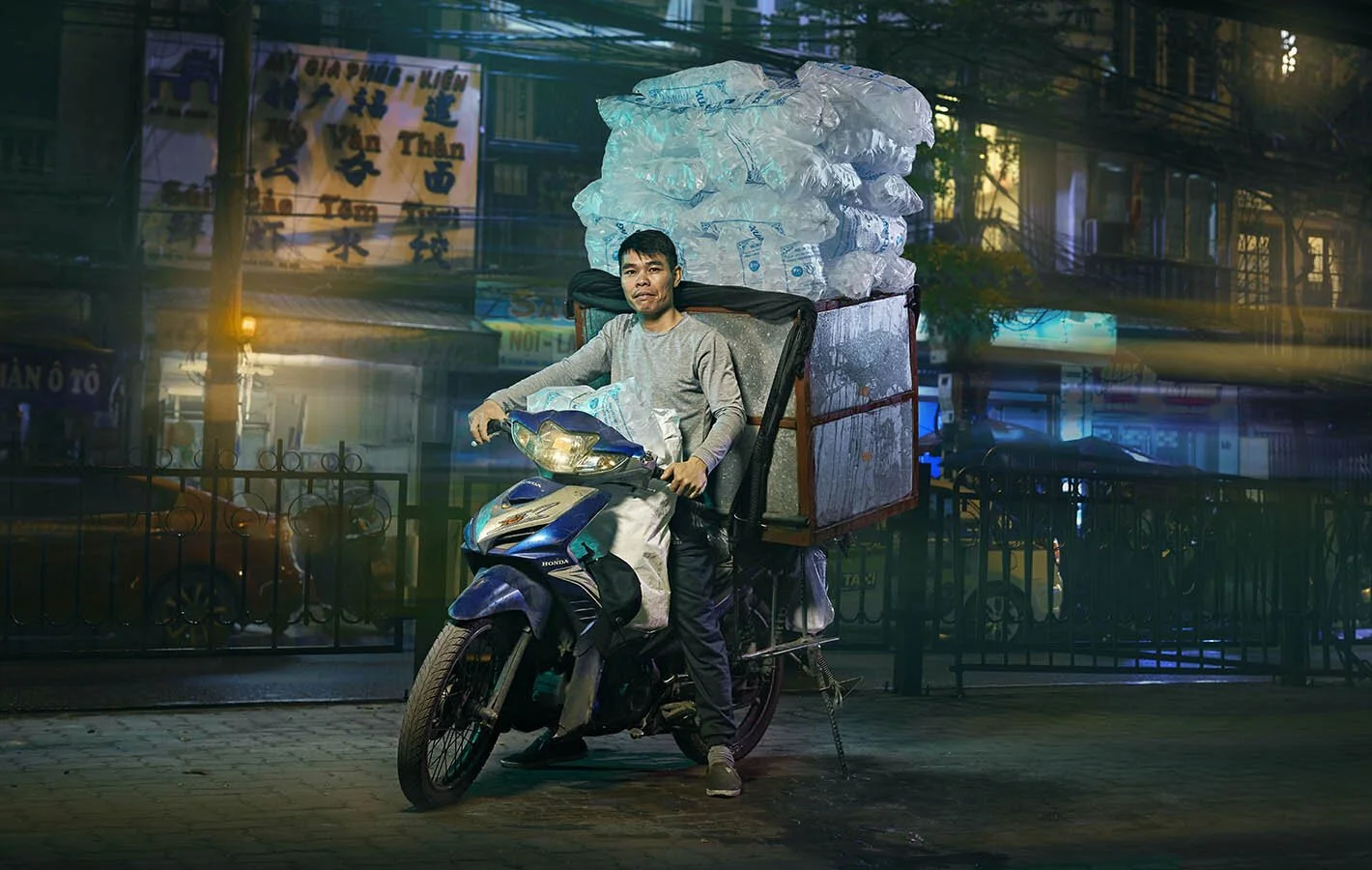 Advertising photographer Jon Enoch’s latest project ‘Bikes of Hanoi’ showing motorbikes carry goods around the city of Hanoi, Vietnam.