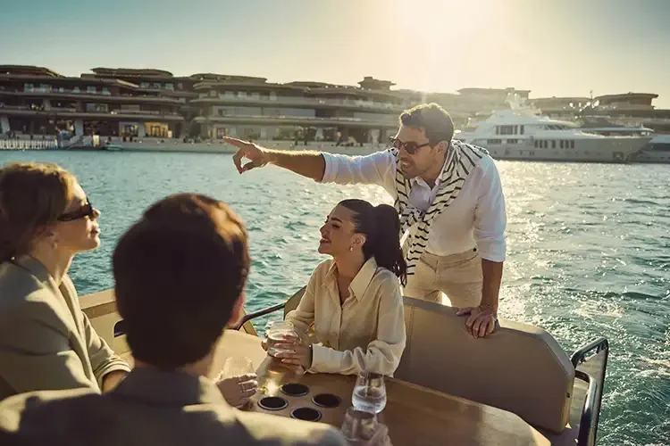 Lifestyle photography by Jon Enoch capturing guests enjoying a luxury boating experience at Sindalah Island, part of Saudi Arabia's NEOM project.