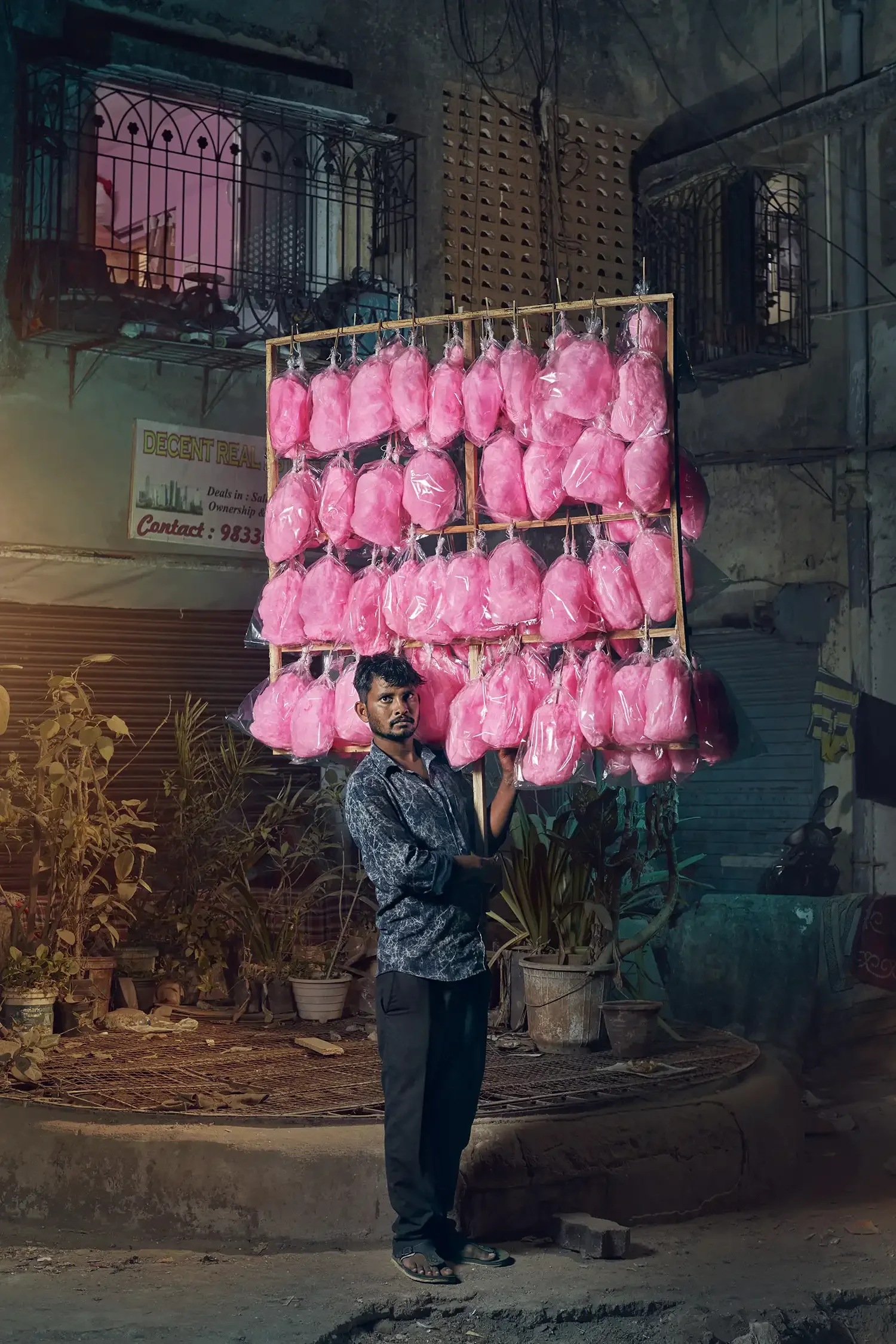 Environmental portrait of a cotton candy seller on the streets of Mumbai, India.