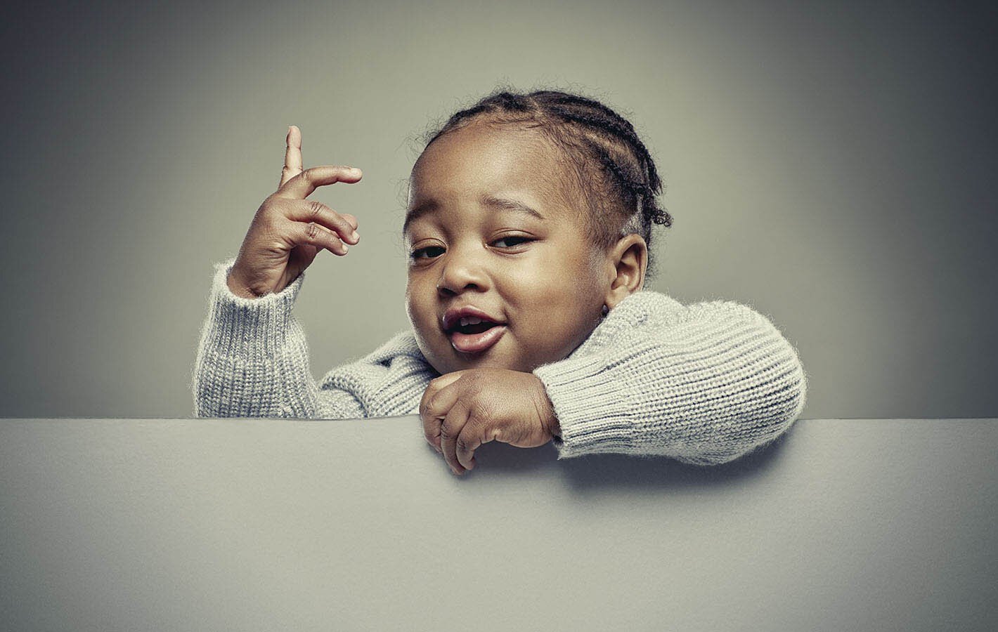 Playful studio portrait of a young child created for the Pura Babies brand launch campaign.