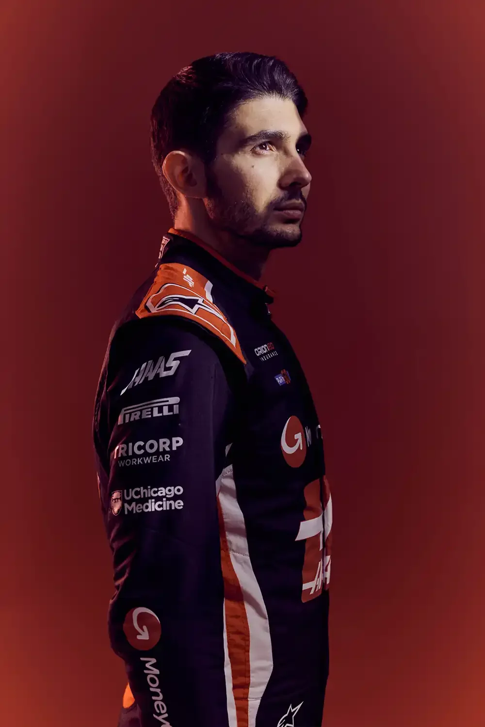 Sports advertising portrait of Haas F1 Team driver Esteban Ocon photographed for a motorsport marketing campaign.