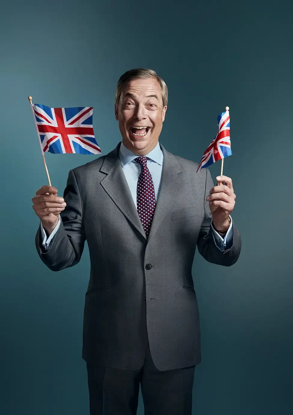 Nigel Farage photographed in a contemporary studio portrait. The image captures one of the most recognisable figures in modern British politics through a character-led approach focused on personality, expression and presence.